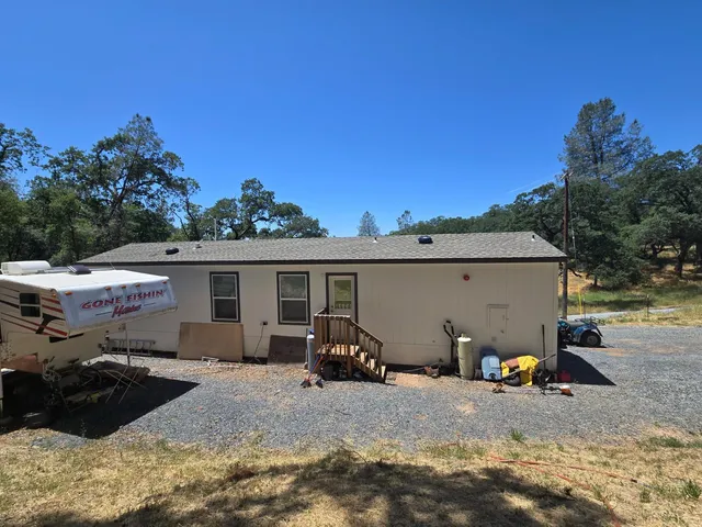 a kitchen with a sink appliances and cabinets