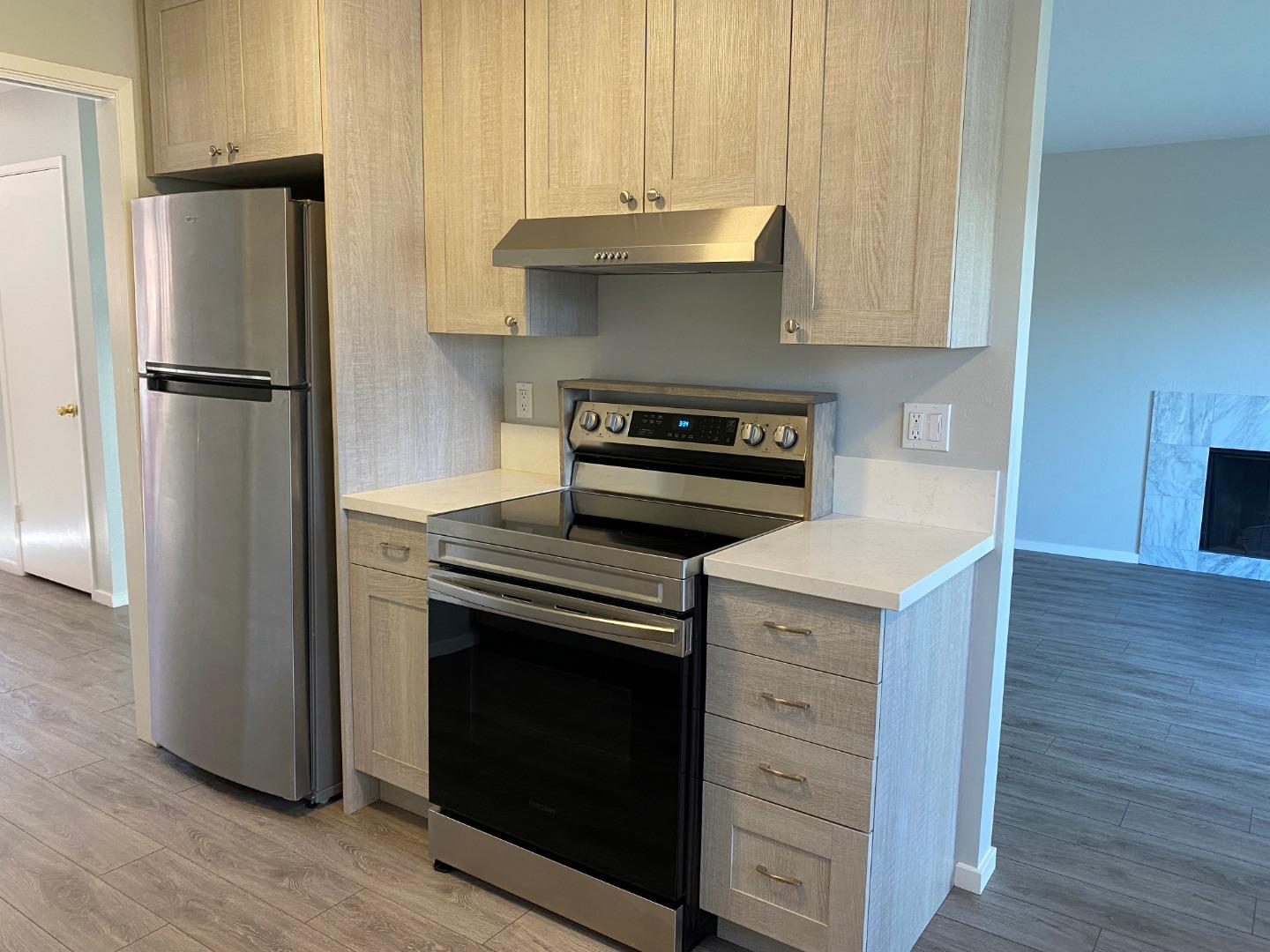 625 Comet Drive Foster City, CA 94404 - Photo 3 of 15 a kitchen with appliances cabinets and a wooden floor