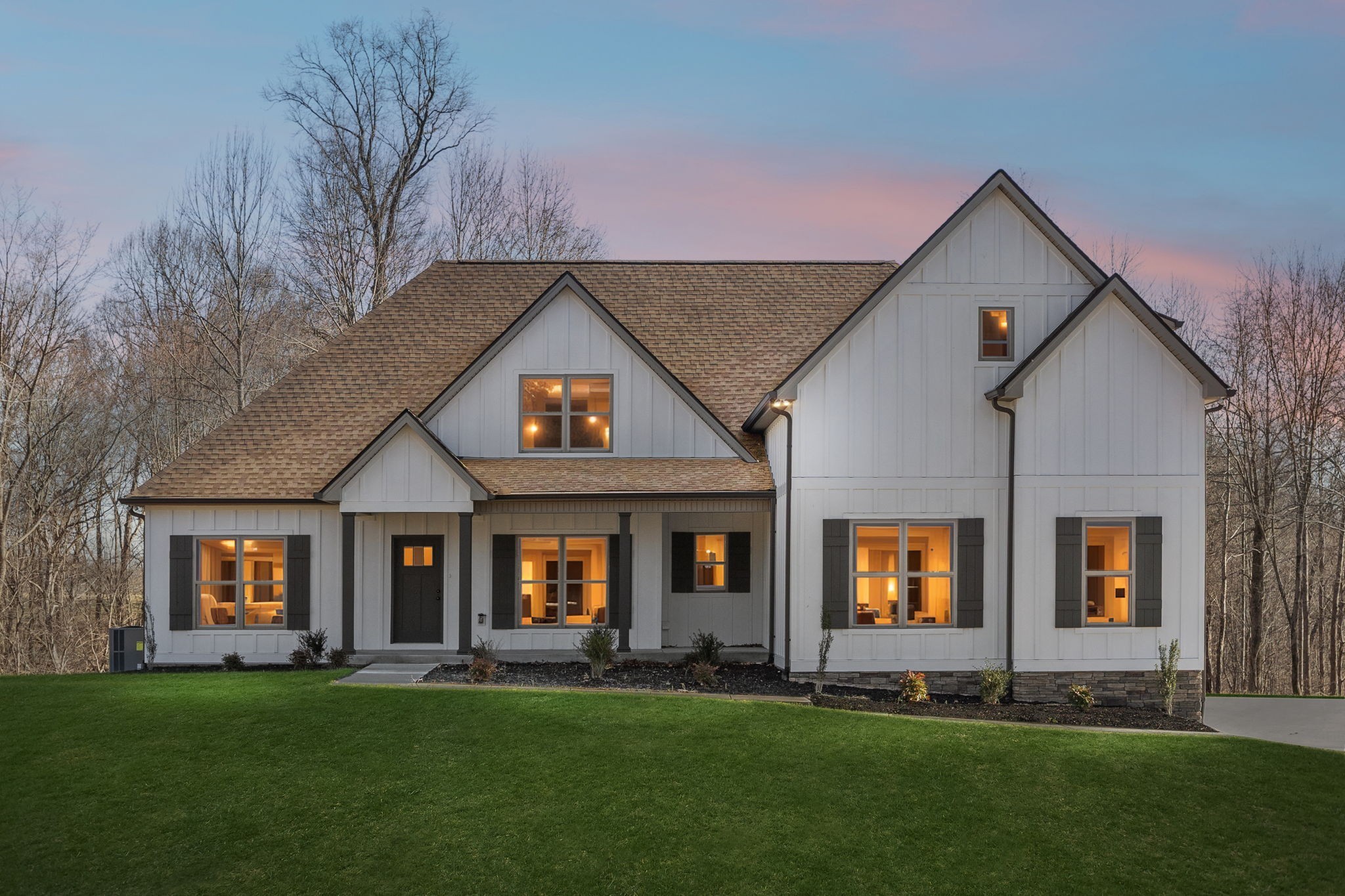 a front view of a house with a yard