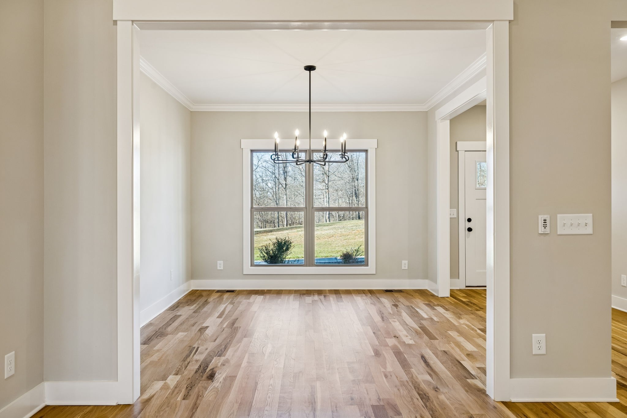 1183 Hangar Road Springfield, TN 37172 - Photo 11 of 69 a view of an empty room with wooden floor and a window