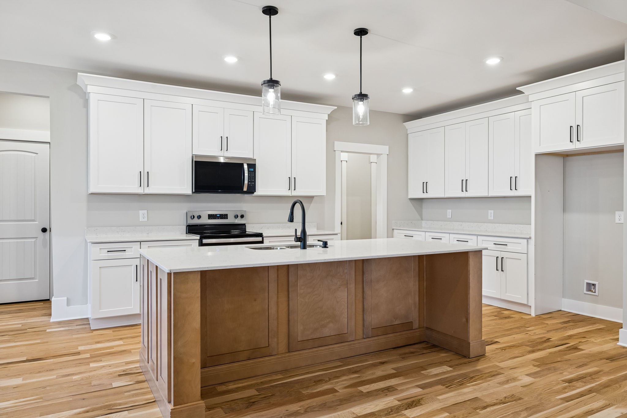 1183 Hangar Road Springfield, TN 37172 - Photo 13 of 69 a kitchen with stainless steel appliances granite countertop a stove a sink and a refrigerator with wooden floor