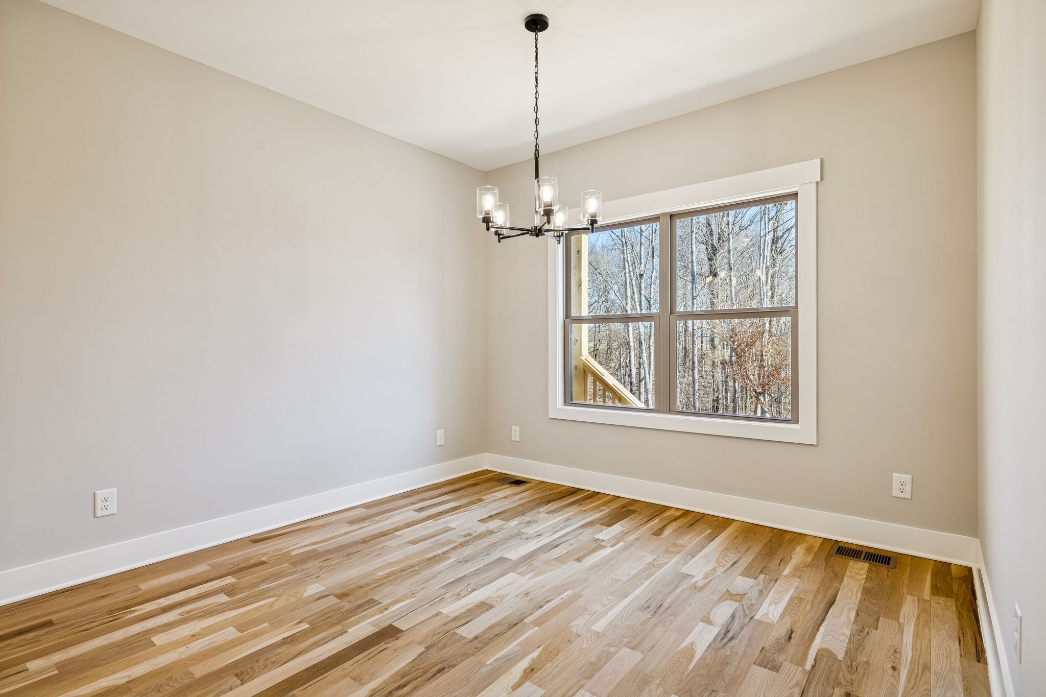 1183 Hangar Road Springfield, TN 37172 - Photo 20 of 69 a view of a room with wooden floor a ceiling fan and a window