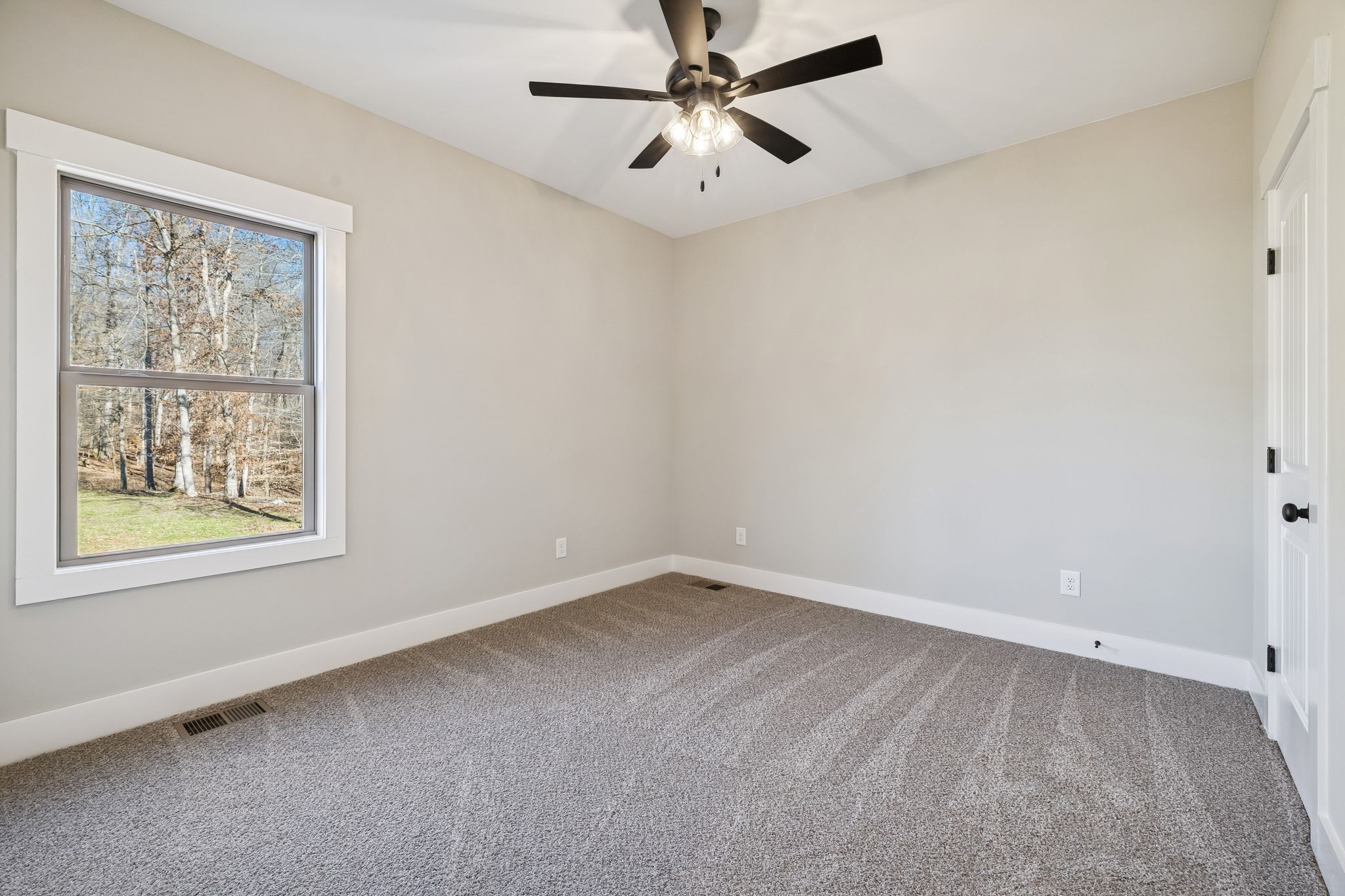 1183 Hangar Road Springfield, TN 37172 - Photo 39 of 69 an empty room with a window and a fan
