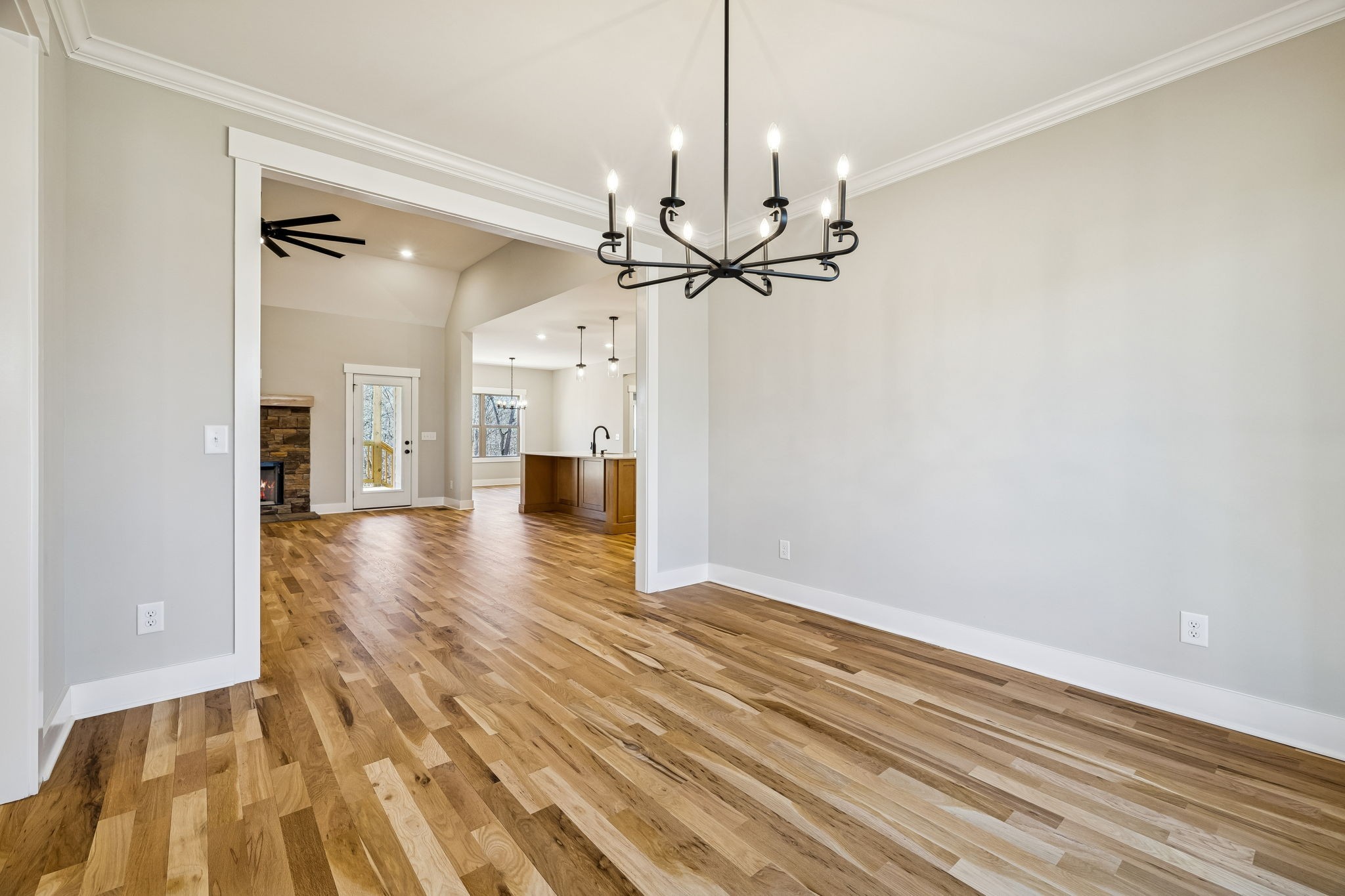 1183 Hangar Road Springfield, TN 37172 - Photo 9 of 69 a view of a hallway with wooden floor and a chandelier