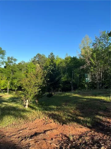 a view of a lake with a big yard