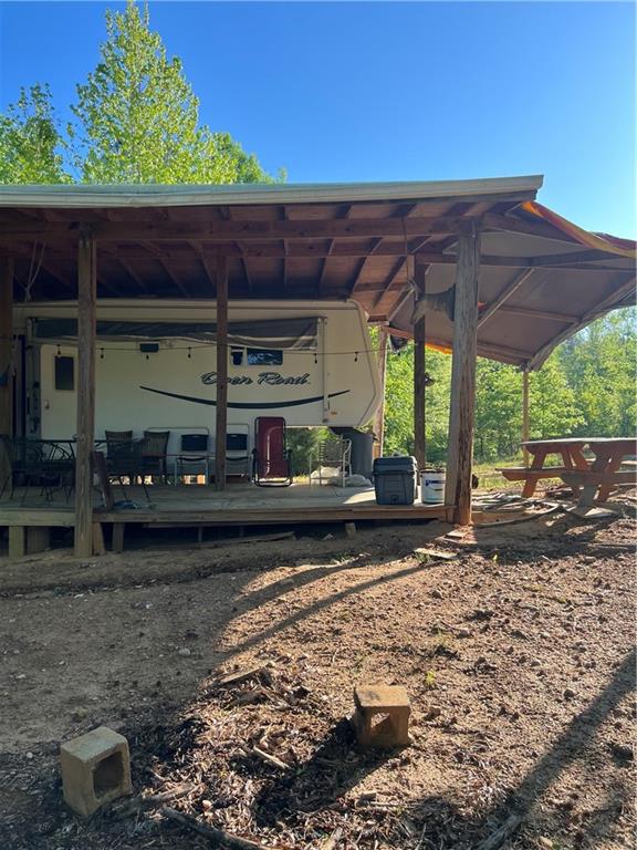 271 Pebble Hill Road Southeast Milledgeville, GA 31061 - Photo 5 of 8 a view of a patio with wooden fence