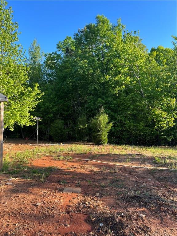 271 Pebble Hill Road Southeast Milledgeville, GA 31061 - Photo 8 of 8 a view of a yard with an outdoor space