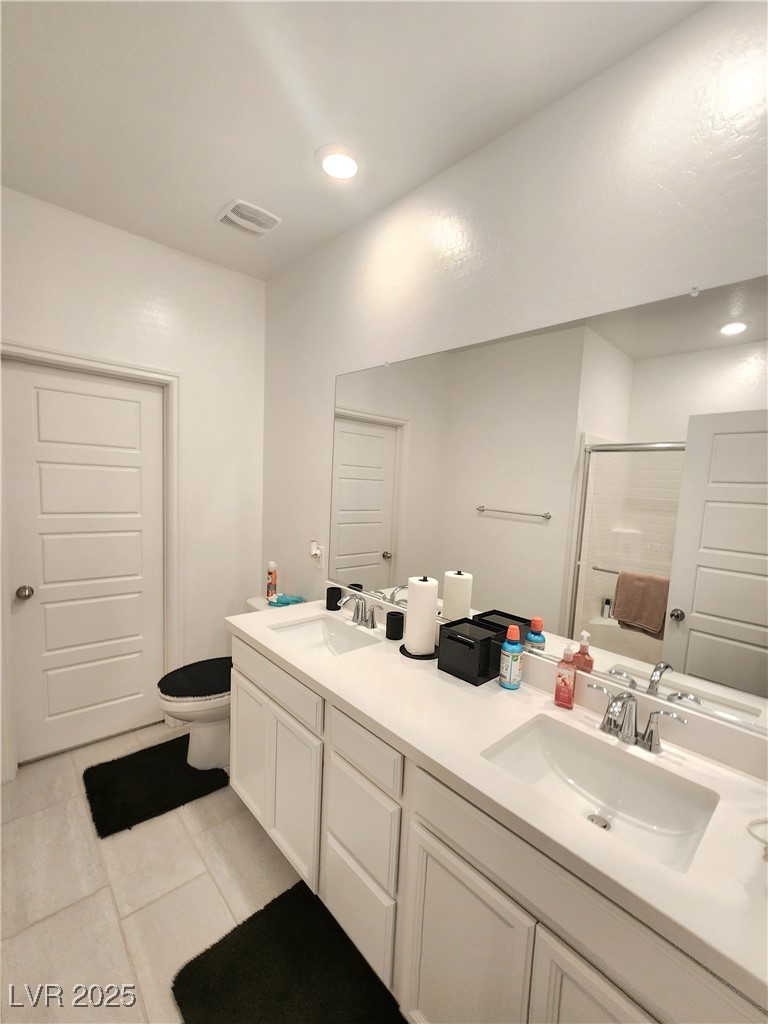 7308 North Decatur Boulevard, Unit 4 North Las Vegas, NV 89084 - Photo 21 of 34 Bathroom featuring a shower with shower door, double vanity, recessed lighting, and tile patterned flooring