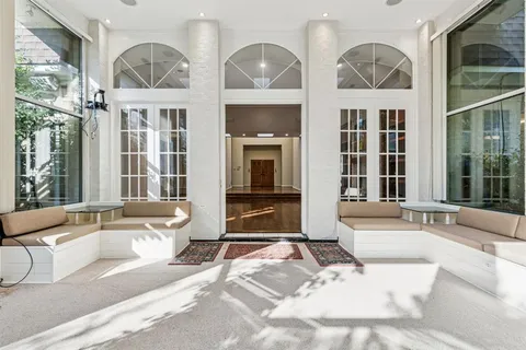 a view of a house with swimming pool and furniture