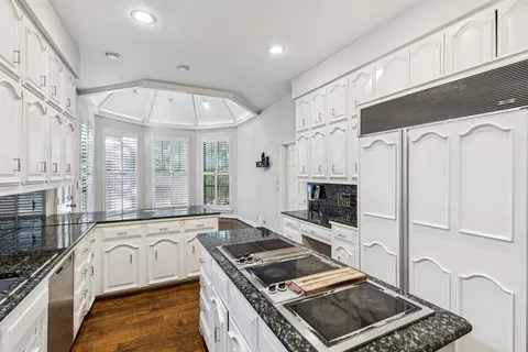 a kitchen with stainless steel appliances granite countertop a stove and a sink