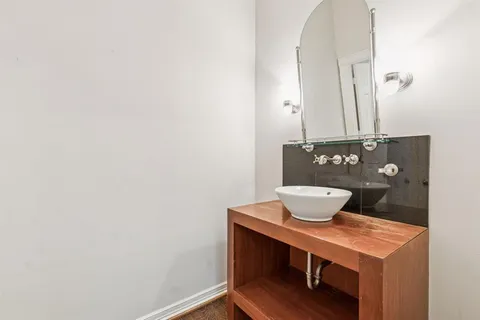 a living room with a table and chairs