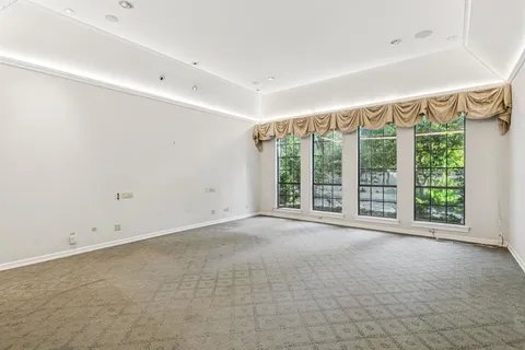 a view of an empty room with a sliding door
