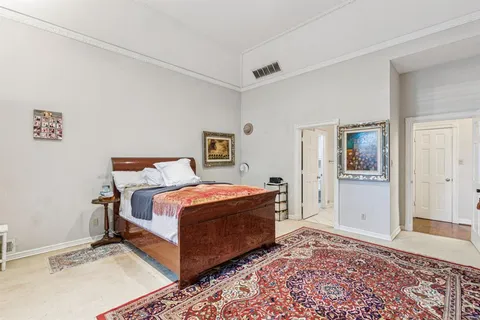 a bed room with a bed and a window