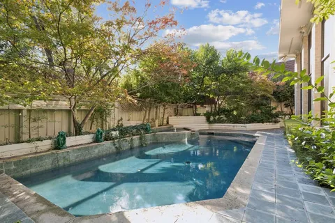 a view of a backyard with sitting area