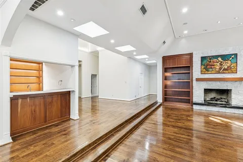a view of kitchen with cabinets and wooden floor