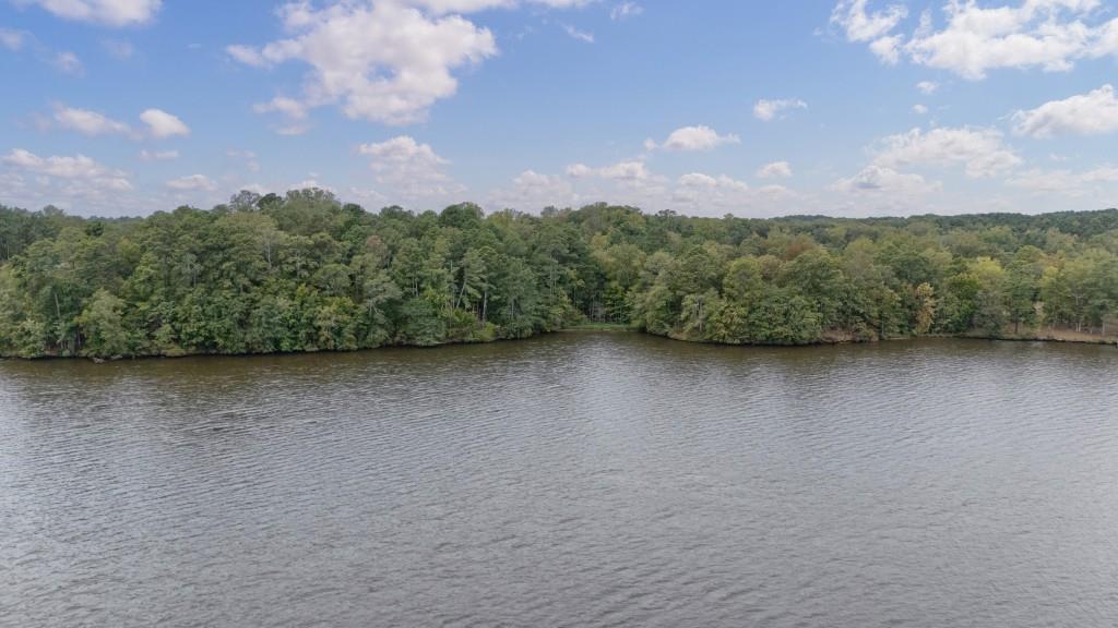 0 Parks Mill Road Buckhead, GA 30625 - Photo 5 of 34 a view of a city next to a lake