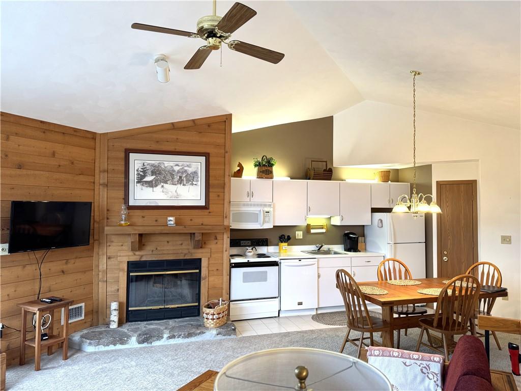 Z1 Sunridge Road Champion, PA 15622 - Photo 9 of 18 a kitchen with a refrigerator stove top oven dining table and chairs