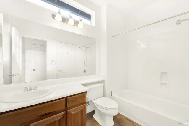 a bathroom with a shower and a sink