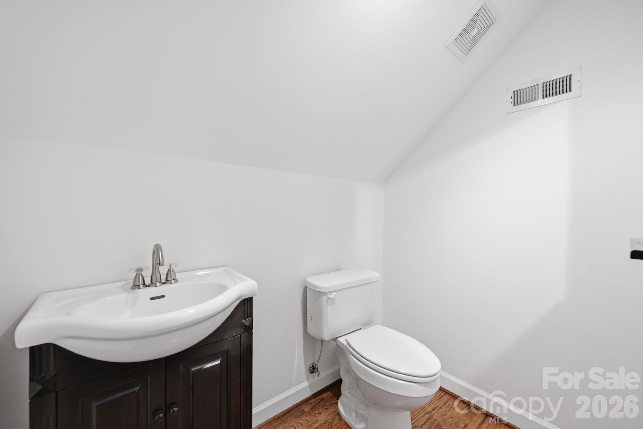 145 Upper Spencer Mountain Road Stanley, NC 28164 - Photo 26 of 29 a bathroom with a sink and a toilet