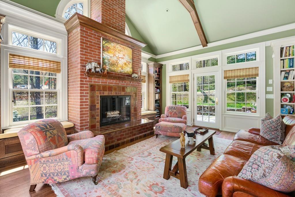 116 Meadowbrook Road Weston, MA 02493 - Photo 13 of 26 a living room with furniture a fireplace and windows