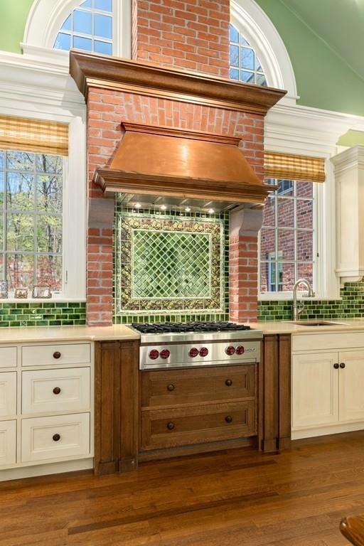 116 Meadowbrook Road Weston, MA 02493 - Photo 14 of 26 a kitchen with granite countertop a stove and a sink