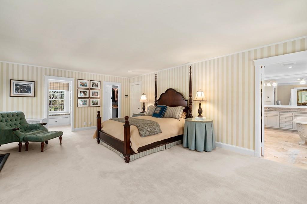 116 Meadowbrook Road Weston, MA 02493 - Photo 15 of 26 a bedroom with a bed and a couch