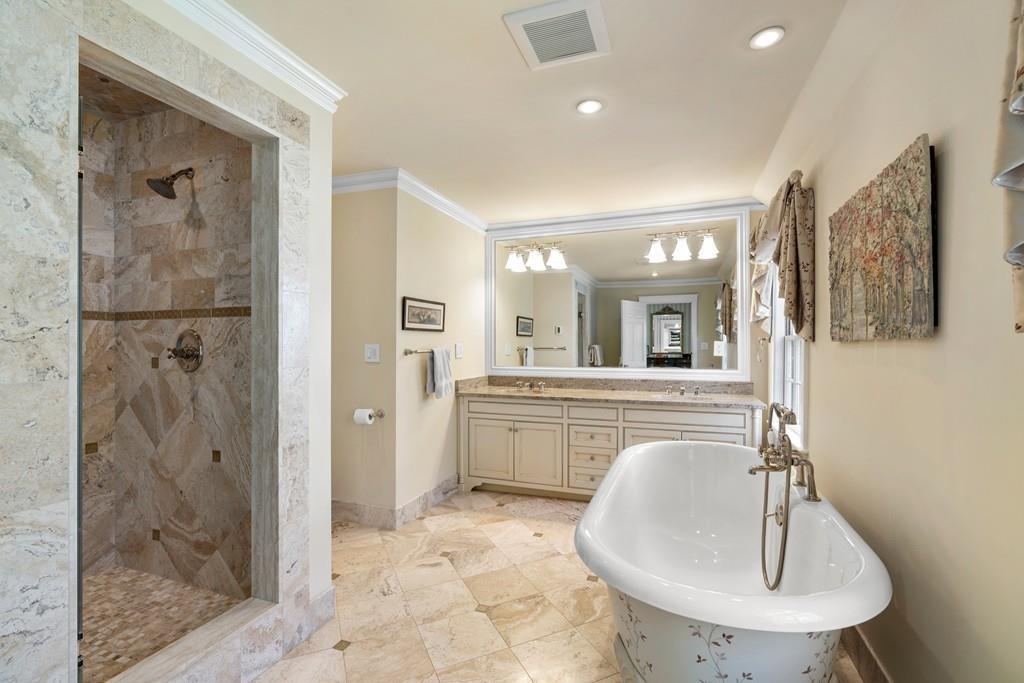 116 Meadowbrook Road Weston, MA 02493 - Photo 16 of 26 a en suite bathroom with a shower sink and mirror