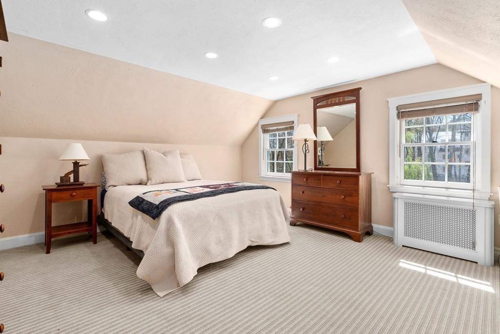 116 Meadowbrook Road Weston, MA 02493 - Photo 19 of 26 a bedroom with a bed and wooden floor