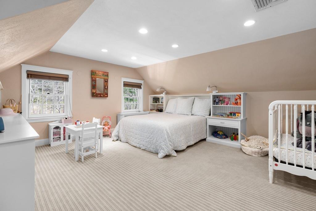 116 Meadowbrook Road Weston, MA 02493 - Photo 20 of 26 a bedroom with furniture and a wooden floor