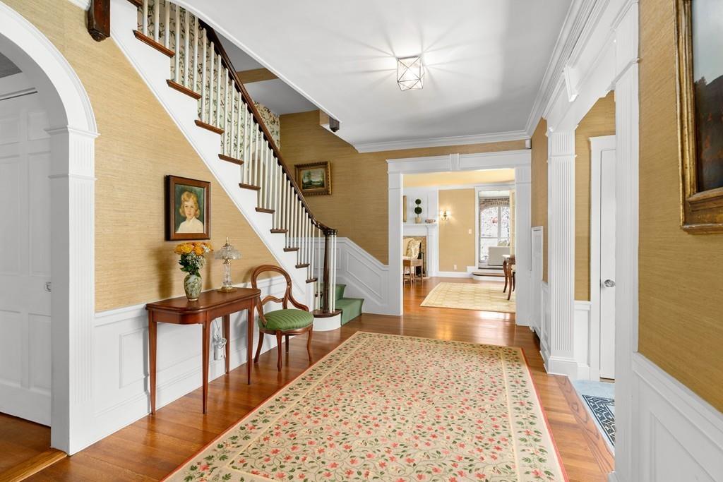 116 Meadowbrook Road Weston, MA 02493 - Photo 2 of 26 a view of an entryway wooden floor and a livingroom