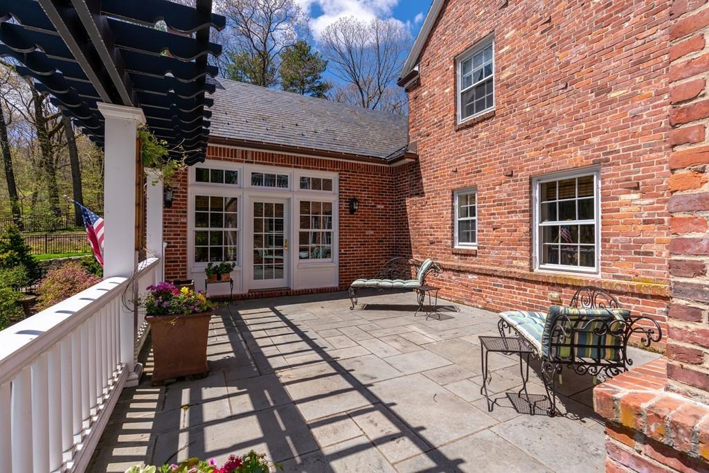 116 Meadowbrook Road Weston, MA 02493 - Photo 21 of 26 a view of house with outdoor seating