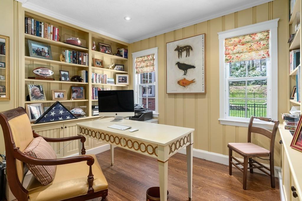 116 Meadowbrook Road Weston, MA 02493 - Photo 7 of 26 a view of a workspace with furniture and a bookshelf