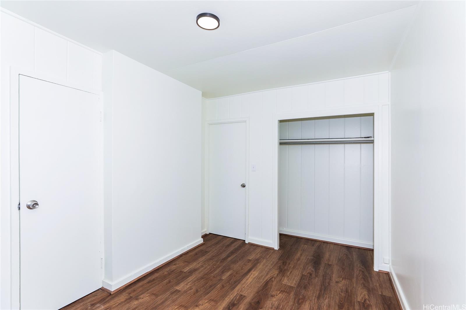 1719 Nuuanu Avenue, Unit 5F Honolulu, HI 96817 - Photo 17 of 25 a view of an empty room with wooden floor