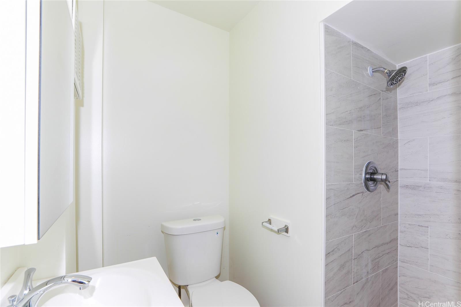1719 Nuuanu Avenue, Unit 5F Honolulu, HI 96817 - Photo 20 of 25 a bathroom with a toilet and a shower