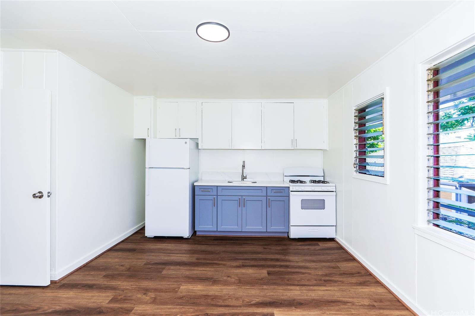 1719 Nuuanu Avenue, Unit 5F Honolulu, HI 96817 - Photo 7 of 25 a view of a kitchen with wooden floor