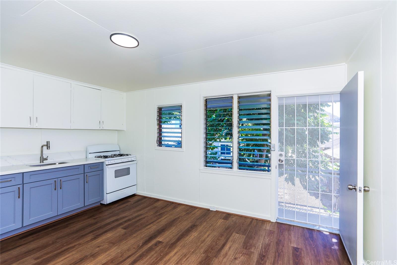 1719 Nuuanu Avenue, Unit 5F Honolulu, HI 96817 - Photo 8 of 25 a kitchen with wooden floors and sink