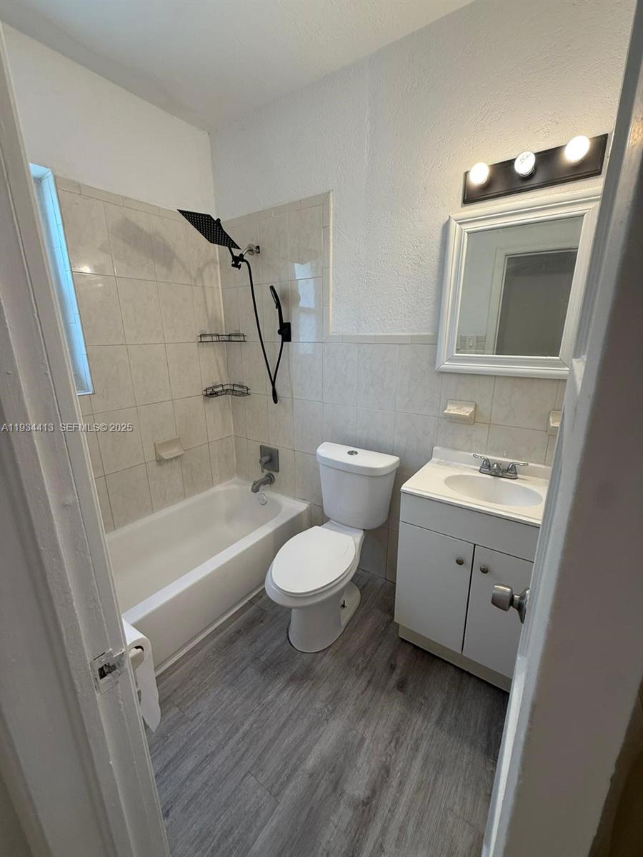 6909 Northwest 2nd Avenue, Unit 6909 Miami, FL 33150 - Photo 9 of 9 a bathroom with a toilet sink and shower