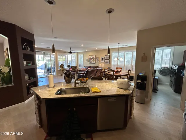 a view of a dining table chairs and entryway