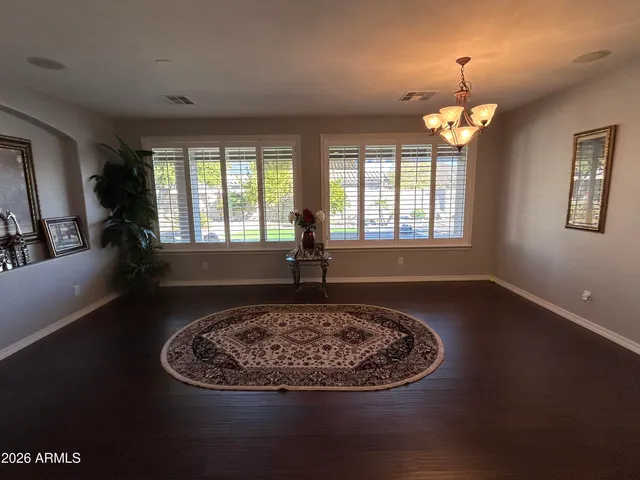 a view of a livingroom with furniture window and wooden floor