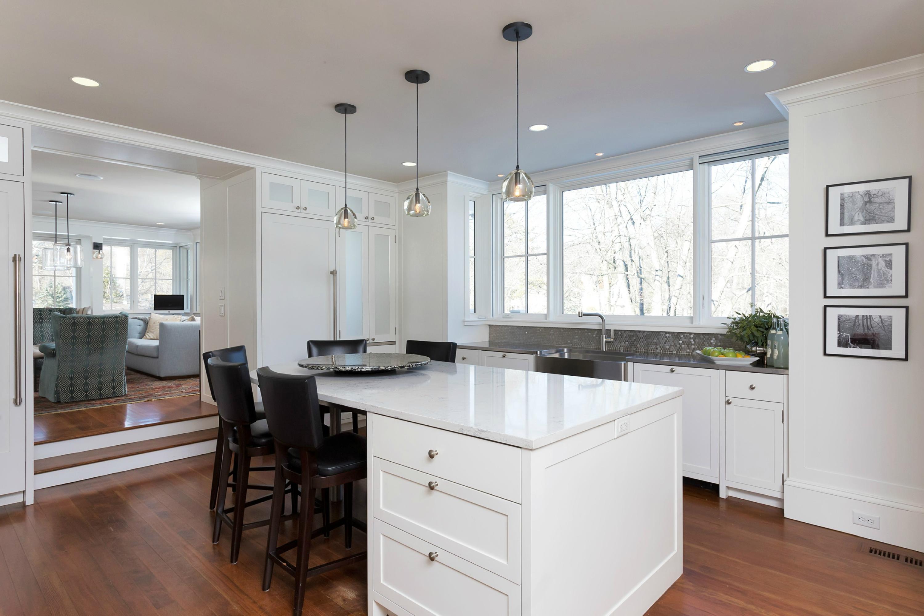 39 Old Farm Road Darien, CT 06820 - Photo 15 of 36 a kitchen that has a sink a table and chairs in it