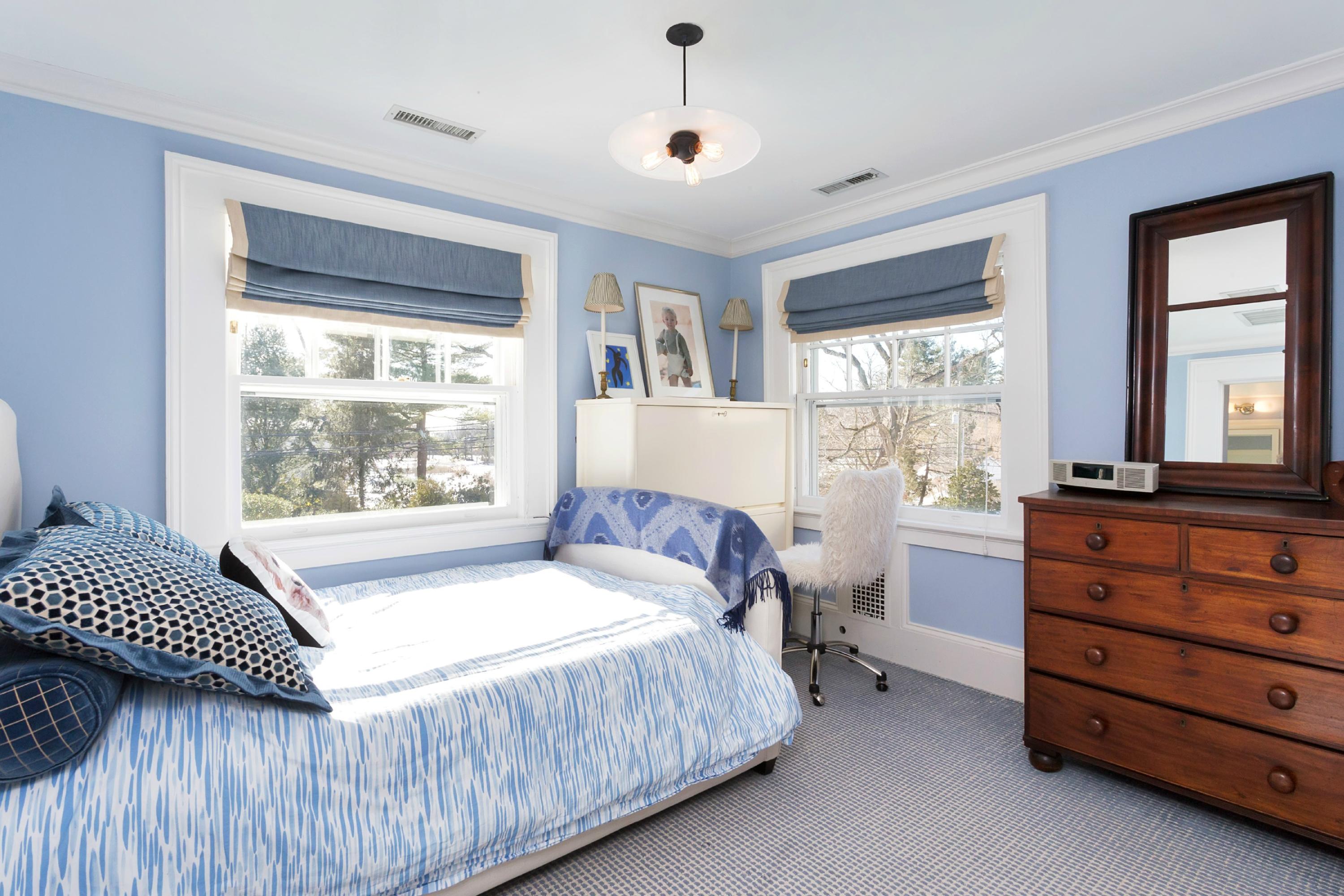 39 Old Farm Road Darien, CT 06820 - Photo 25 of 36 a bedroom with a bed and a window