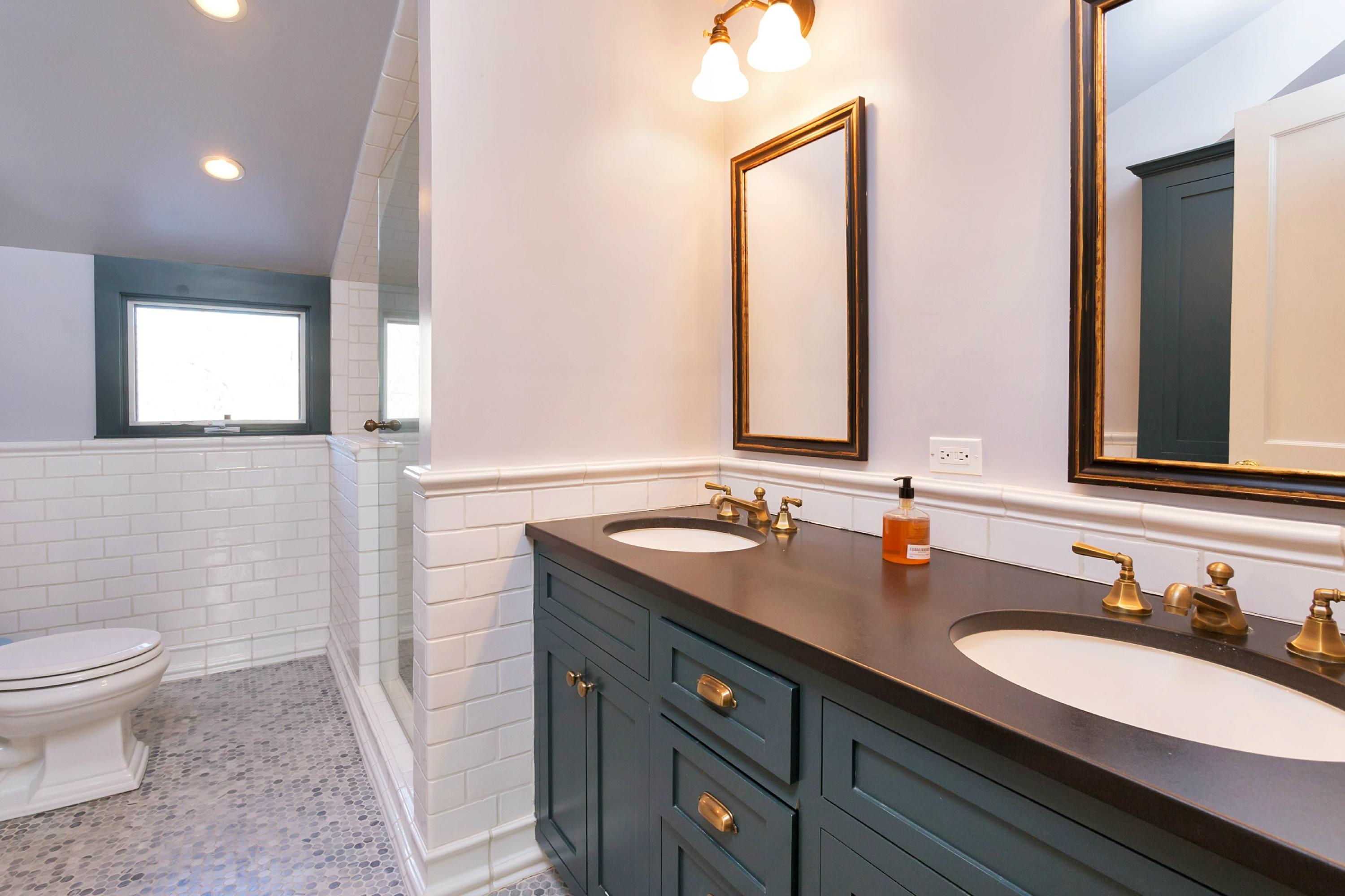 39 Old Farm Road Darien, CT 06820 - Photo 27 of 36 a bathroom with a granite countertop sink and a mirror