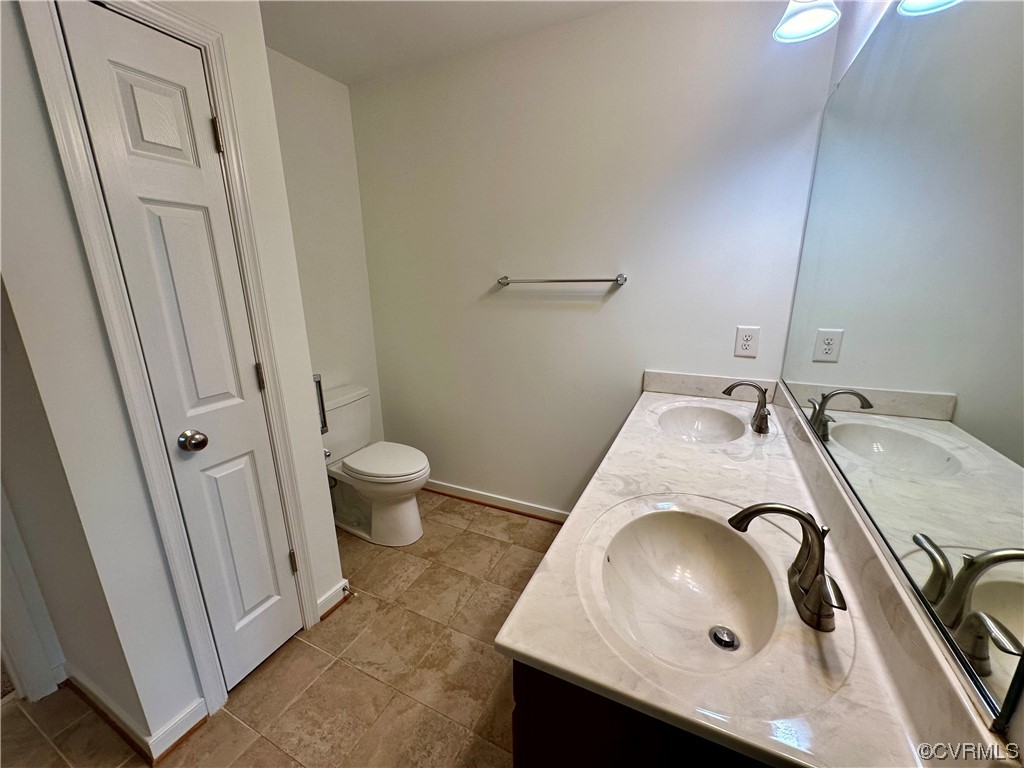 3314 Kennington Park Road Aylett, VA 23009 - Photo 13 of 36 a bathroom with a granite countertop sink and a toilet