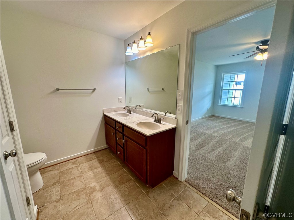 3314 Kennington Park Road Aylett, VA 23009 - Photo 14 of 36 a bathroom with a sink vanity and mirror