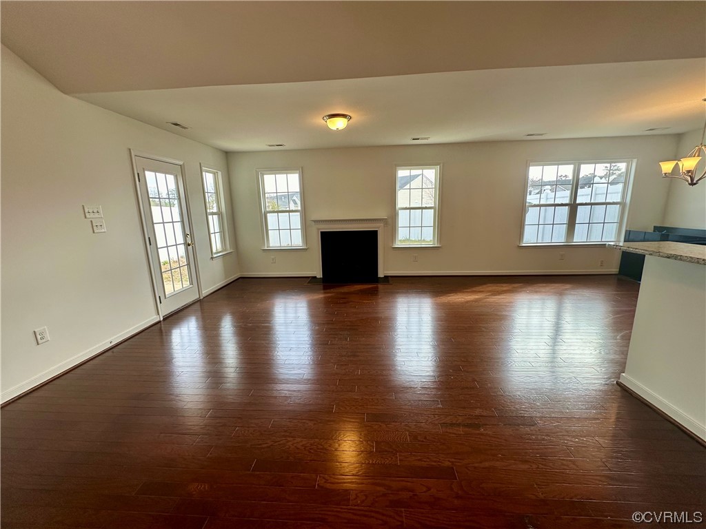 3314 Kennington Park Road Aylett, VA 23009 - Photo 2 of 36 an empty room with wooden floor and windows