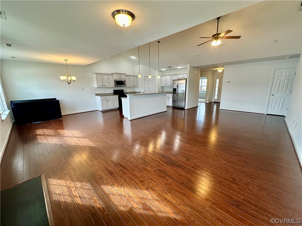 3314 Kennington Park Road Aylett, VA 23009 - Photo 5 of 36 a view of a living room a kitchen with wooden floor and a kitchen