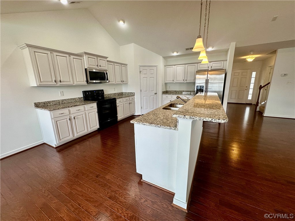 3314 Kennington Park Road Aylett, VA 23009 - Photo 7 of 36 a open kitchen with white cabinets and wooden floor