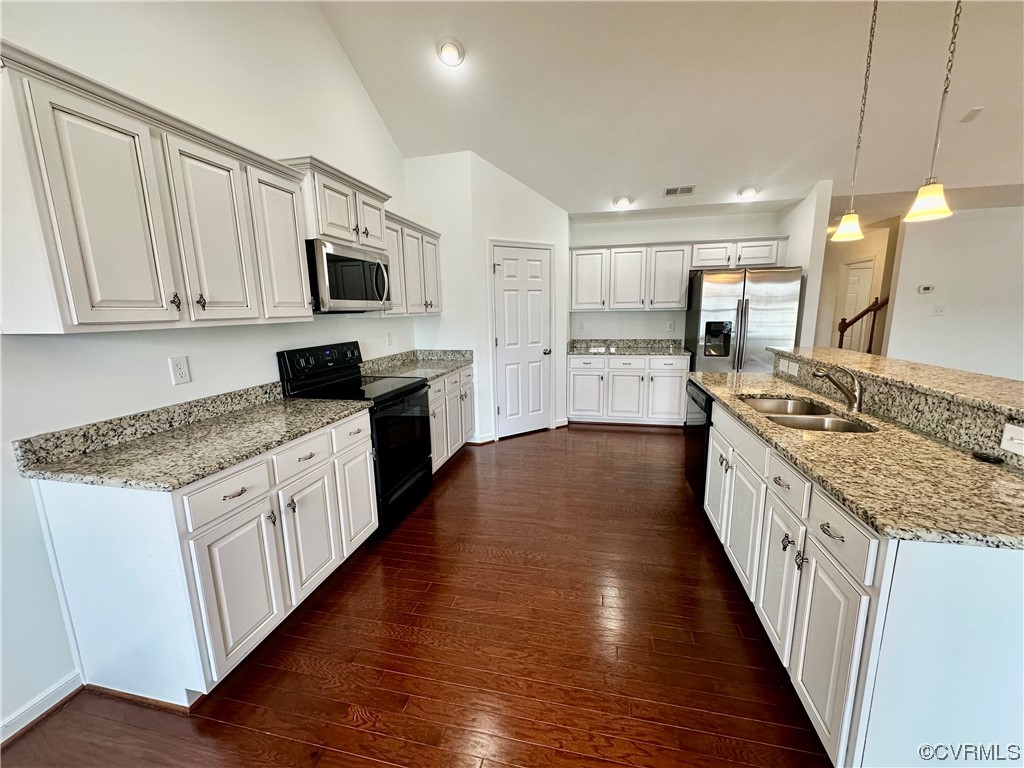 3314 Kennington Park Road Aylett, VA 23009 - Photo 8 of 36 a large kitchen with stainless steel appliances granite countertop a large stove a sink dishwasher and a microwave oven with wooden floor