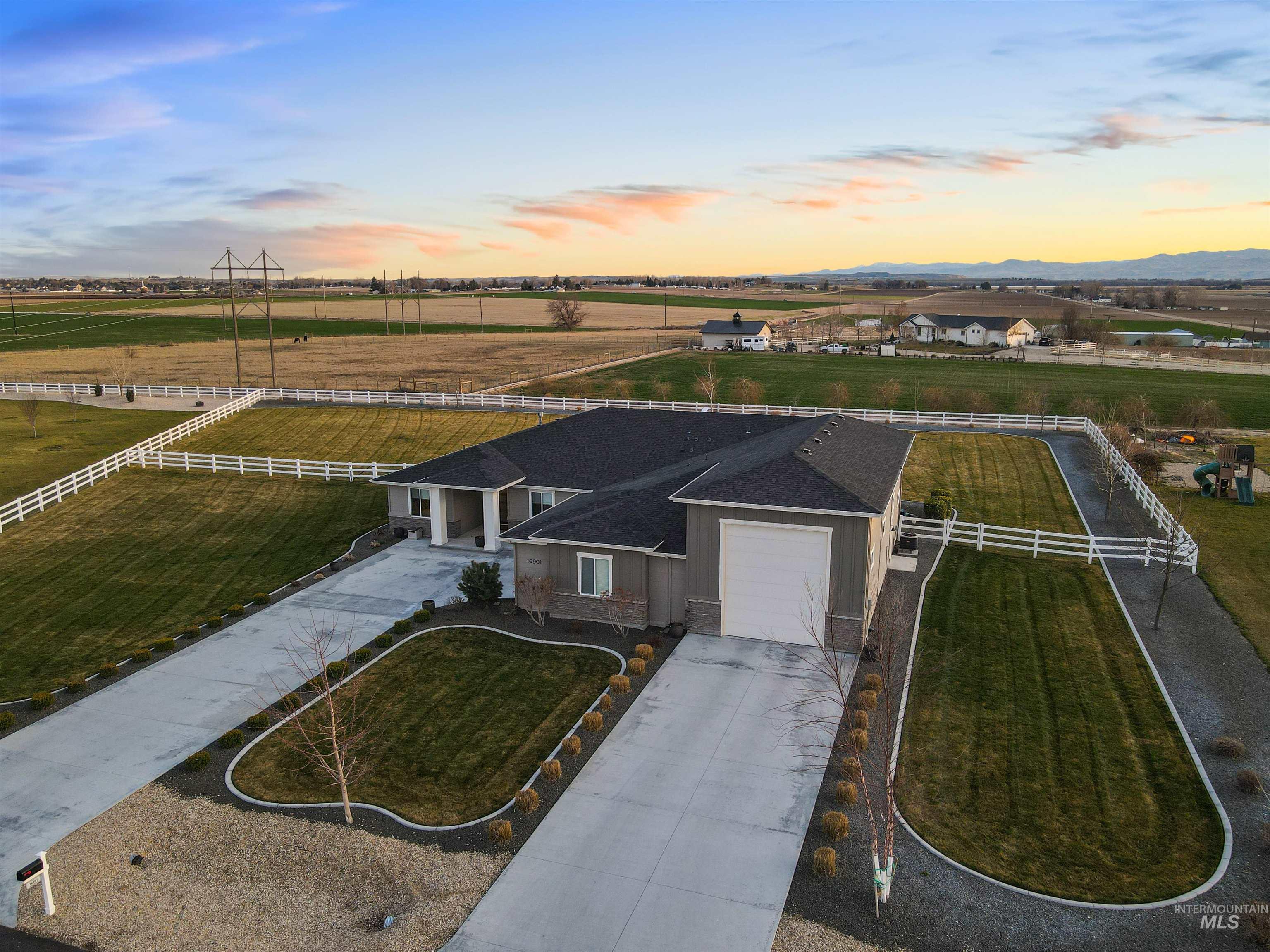 16901 Spring Meadow Drive Caldwell, ID 83607 - Photo 2 of 50 Aerial view at dusk of a view of rural / pastoral area
