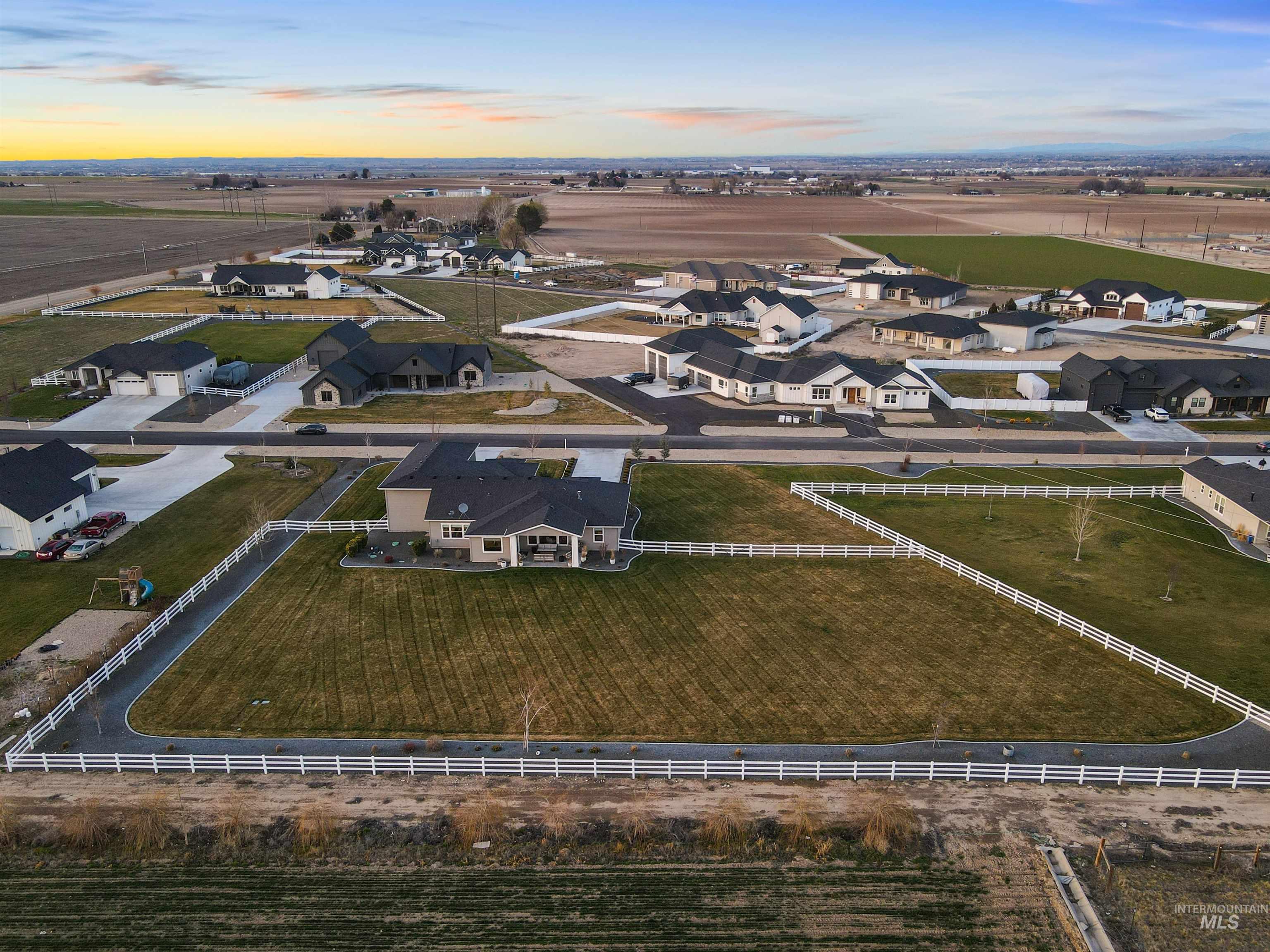 16901 Spring Meadow Drive Caldwell, ID 83607 - Photo 43 of 50 Aerial view at dusk of a residential view and a rural view